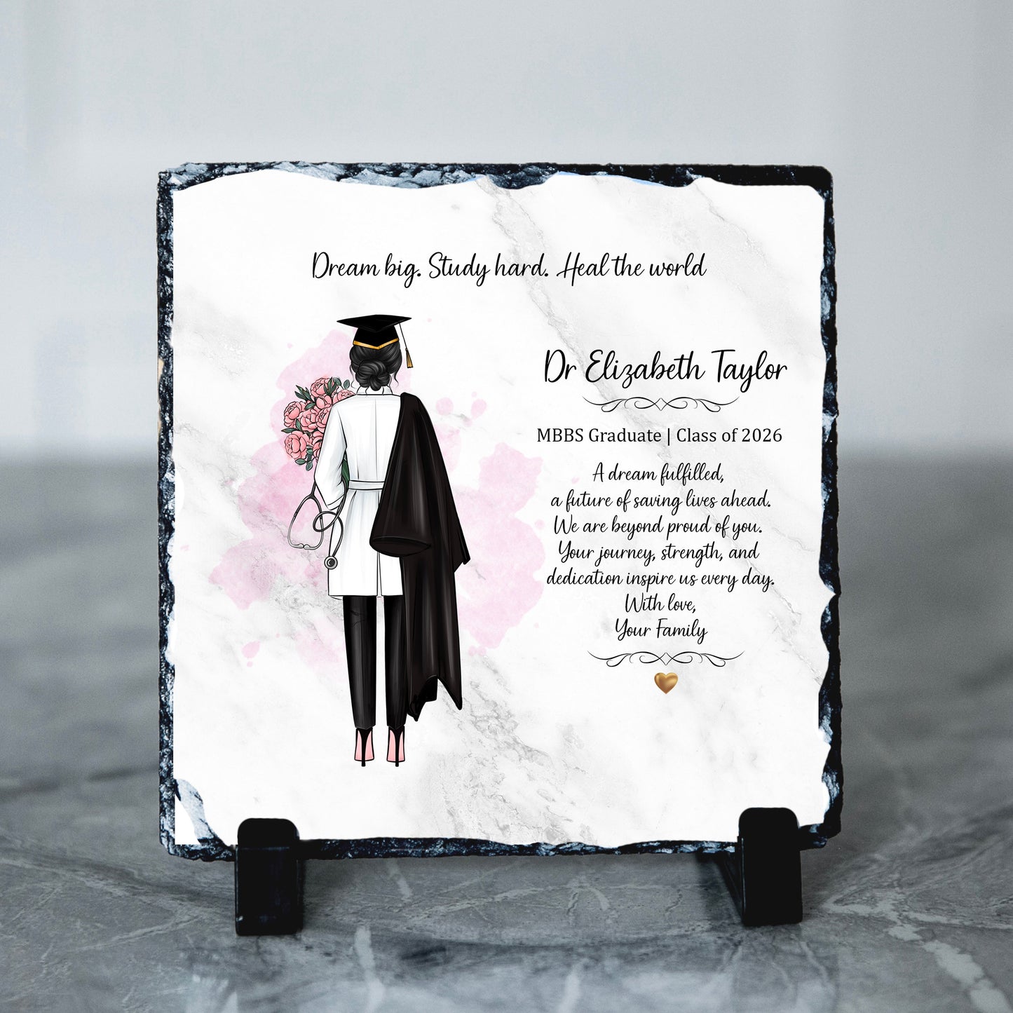 Graduation-themed slate plaque with a graduate illustration and personalized text on a gray background.